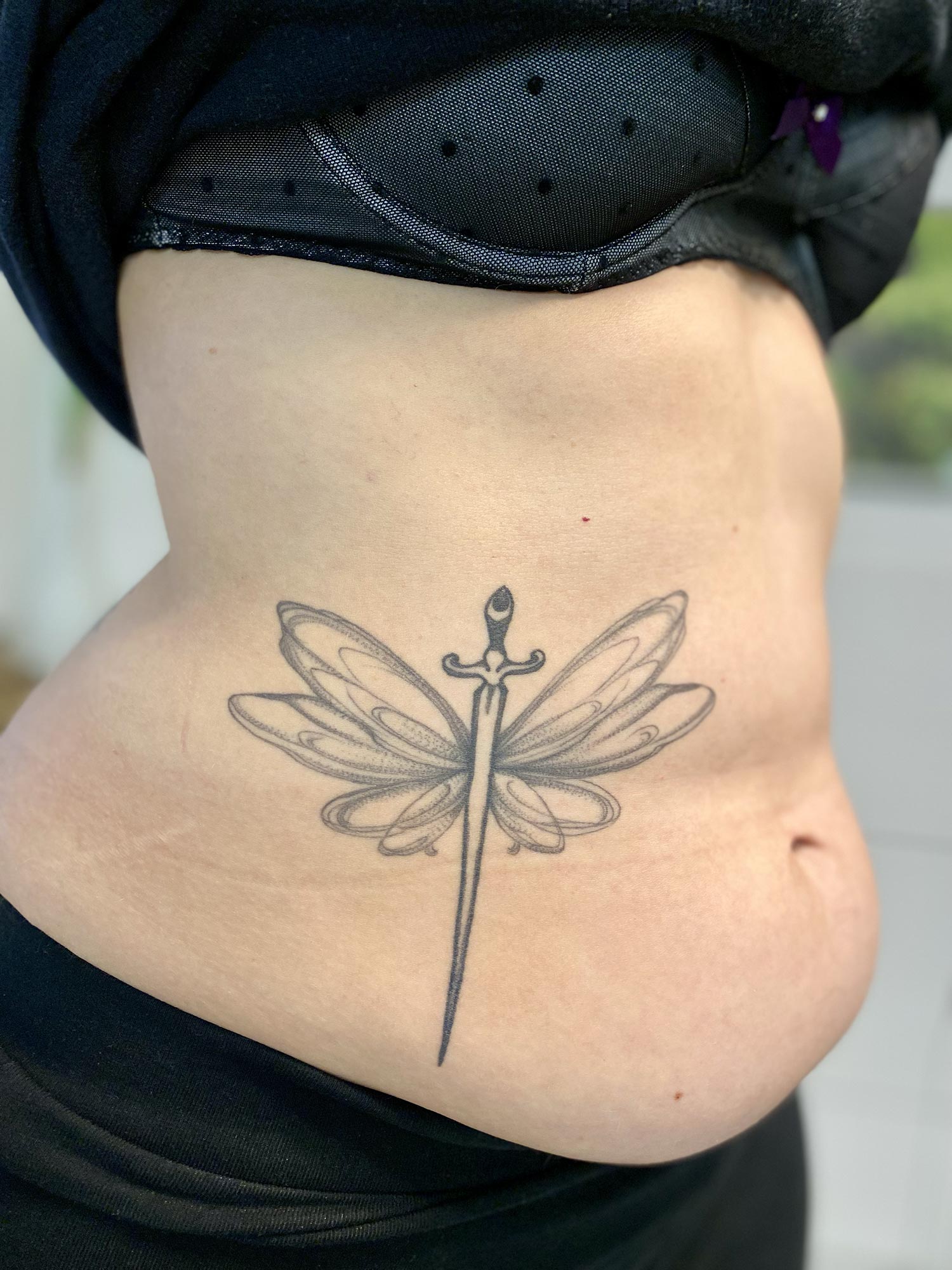 Maries Tattoo am Bauch
